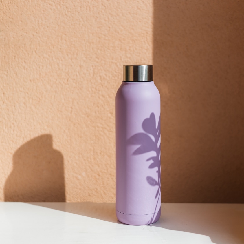 Oublé bottle lifestyle image in about carousel