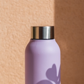 Oublé bottle alternate lifestyle image in about carousel