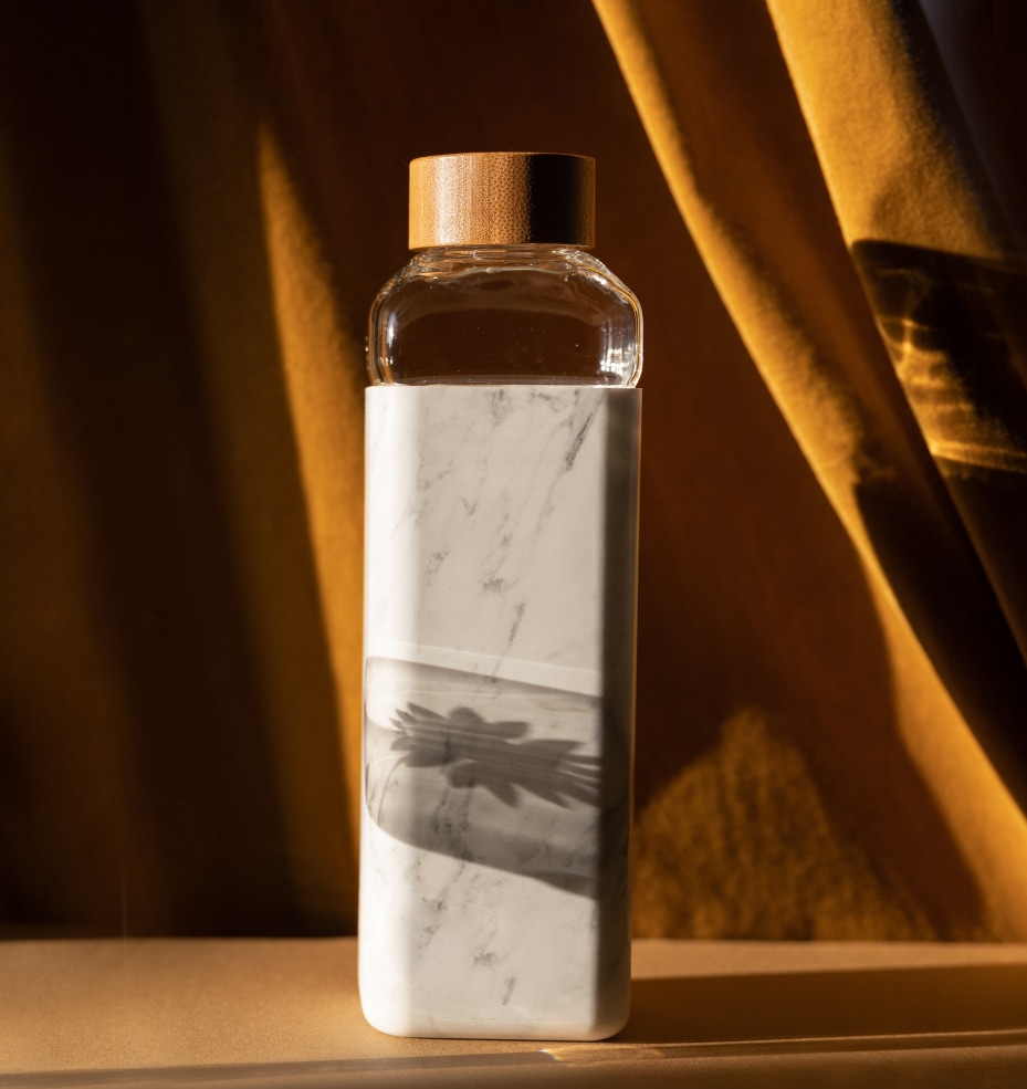 Oublé bottle collection hero slide with lifestyle product image